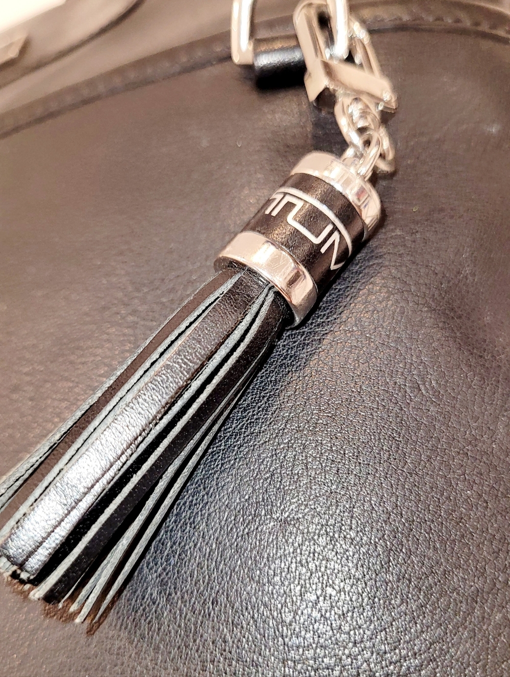 Tumi Black Leather Crossbody with Tassel Charm - Picture 3 of 9